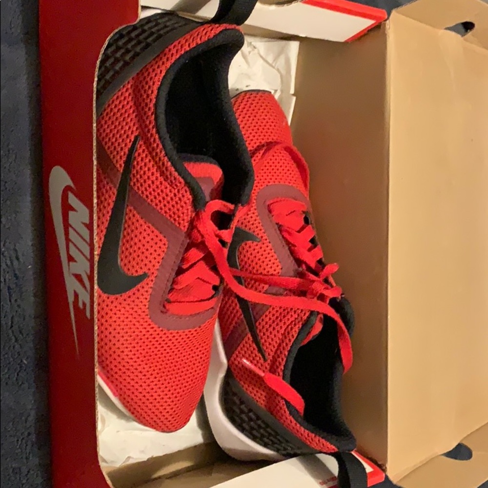 Woman’s Red Nike, says 6.5 but they fit 8-8.5
